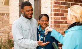 couple receiving keys to home