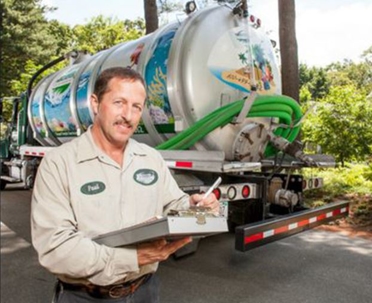 septic truck and worker