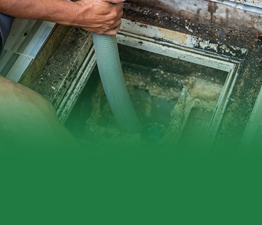 tech working on clogged septic drain