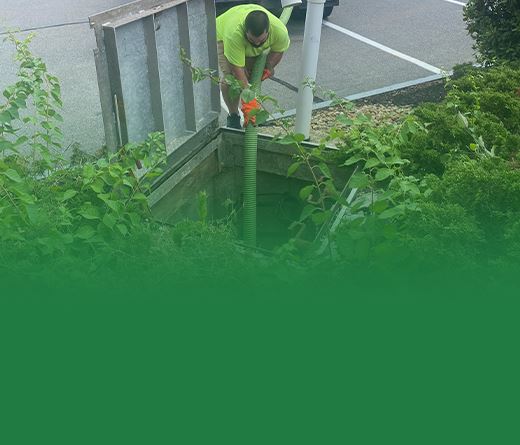 technician draining septic system